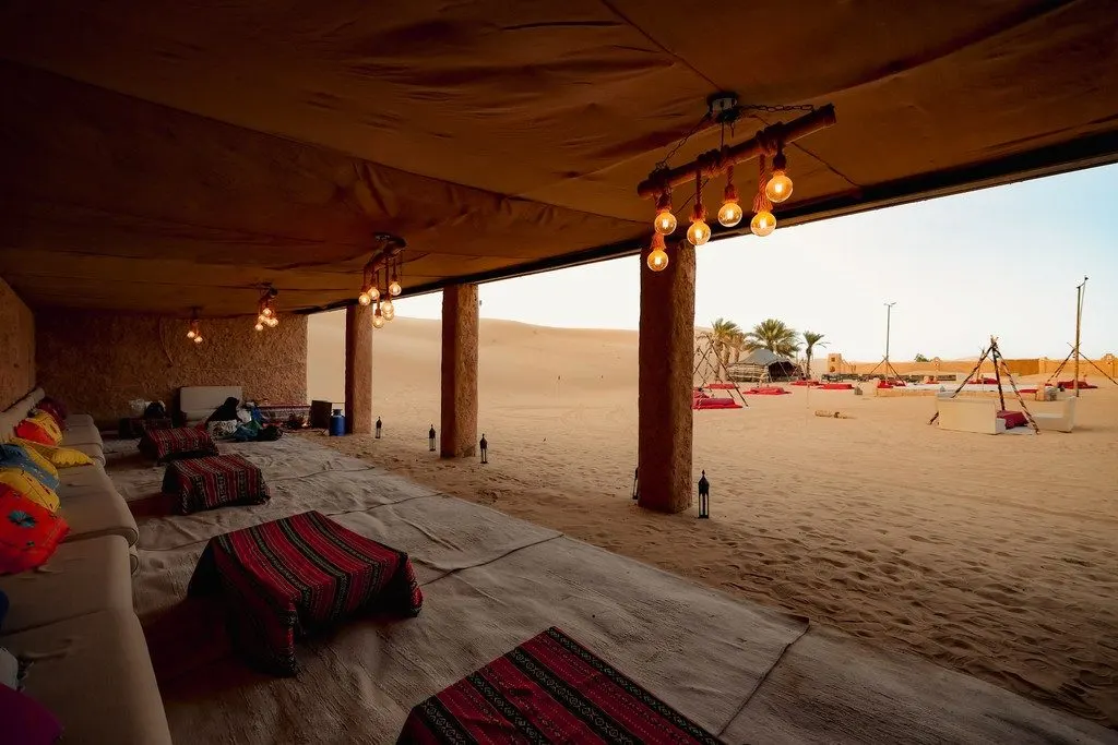 Authentic Emirati majlis seating under desert lanterns
